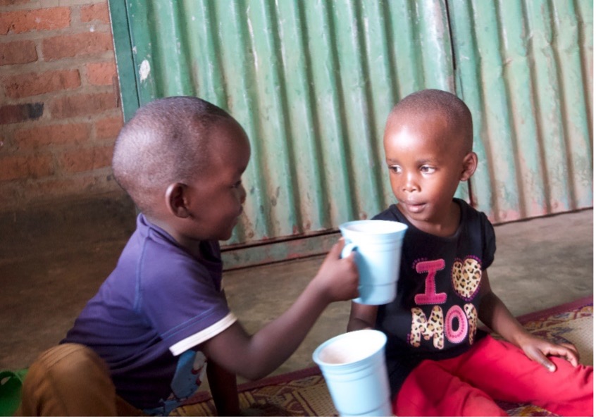 Children sharing porridge